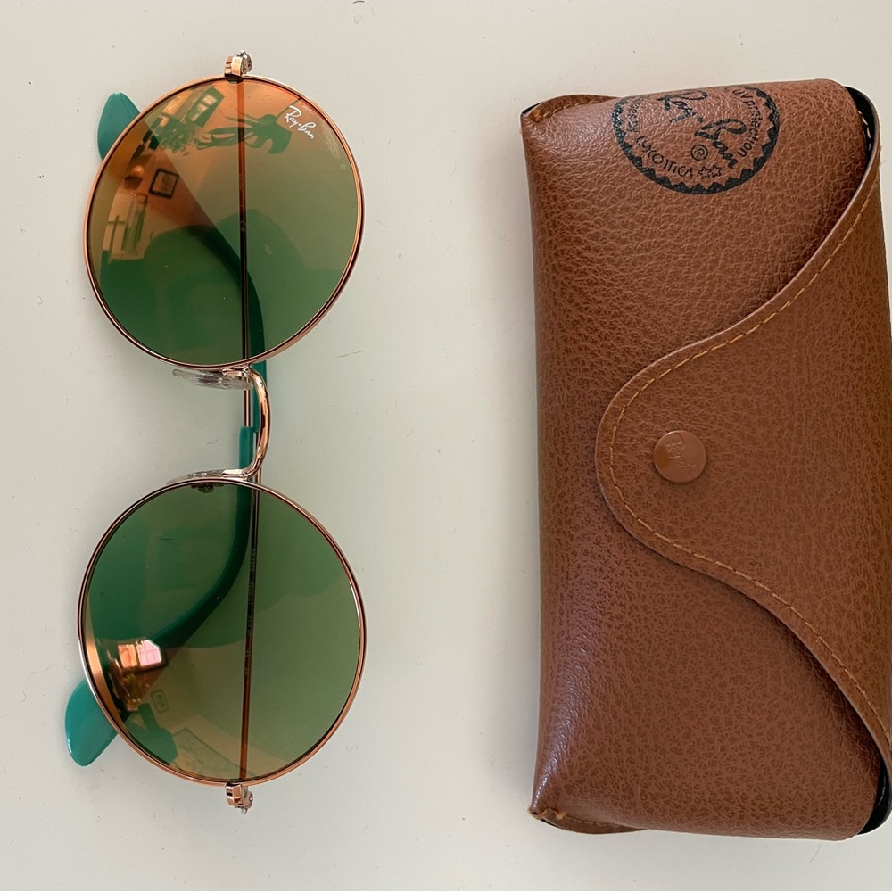 Like new! Circular sea-foam green Ray-Bans with a rose gold rim with case.